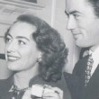 December 1945. With Gregory Peck, receiving the Golden Apple award from the Hollywood Women's Press Club's Kay Proctor.