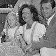 April 1945. Joan, Phillip, and Christina pose for troops at Joan's Brentwood home.