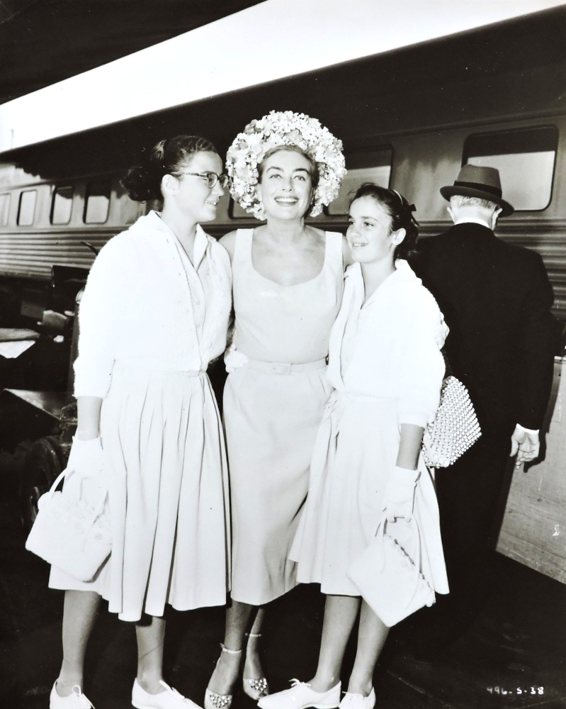 Summer 1960. In South American train station with twins Cathy and Cindy.