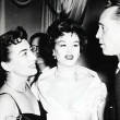 1953. Two candids at NYC's Harwyn Club with ex-husband Franchot Tone.