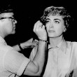 1953. On the set of 'Torch Song' with MGM makeup man Eddie Allen.