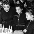 January 13, 1955. The twins celebrate their 8th birthday on the 'Female on the Beach' set.