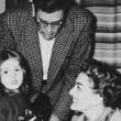 New Year's Eve, 1955. Joan throws a party for writer Paul Gallico, pictured here with his daughter.