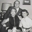 Joan's birthday on the set of 'Queen Bee' with producer Jerry Wald, Lucy Marlow, and William Leslie. Includes press caption.