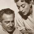 1957. With Rossano Brazzi on the set of 'Esther Costello.' 