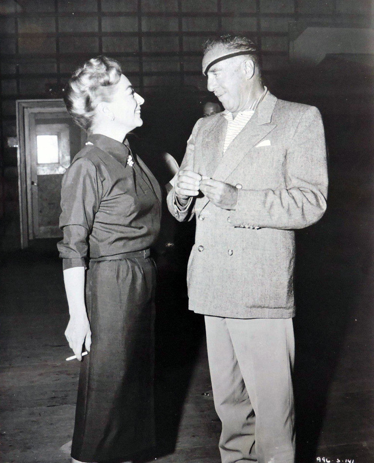 Director Raoul Walsh visits the 'Best of Everything' set.