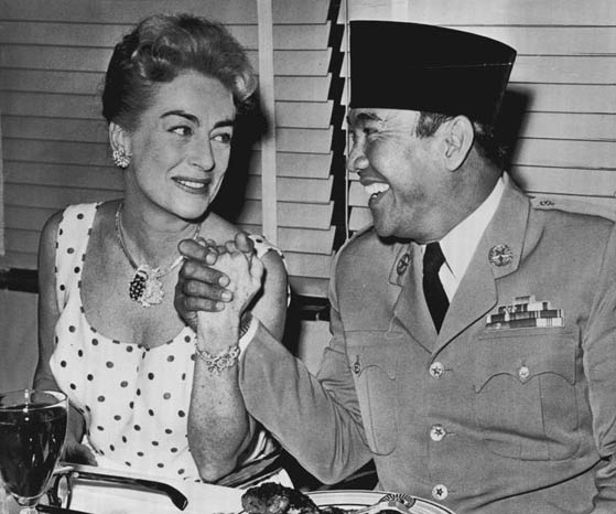 June 1959. With Indonesian president Sukarno at a 20th-Century Fox lunch. (Thanks to Bryan Johnson.)