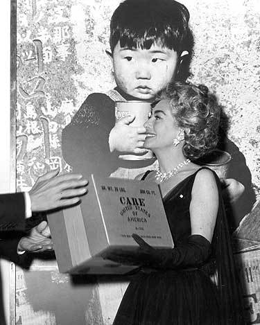 1963. Receiving a 'CARE' award.