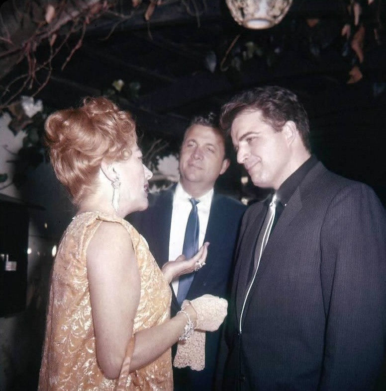 1962. At Hollywood party in her honor, with Vince Edwards.