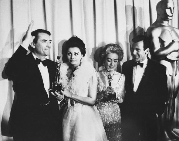 At the 4/8/63 Academy Awards with Gregory Peck, Sophia Loren, and Maximilian Schell. (Thanks to Bryan.)