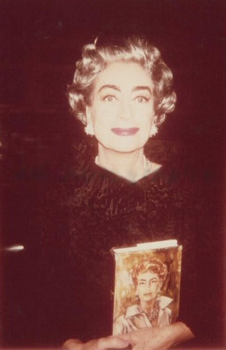 1963, with a copy of 'Portrait of Joan.'