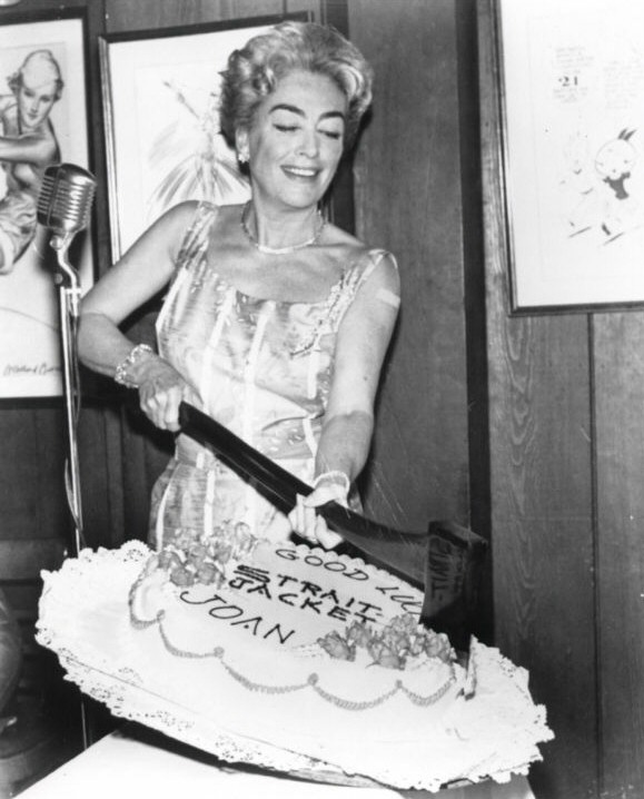 1963. A cake at the beginning of filming for 'Strait-Jacket.'