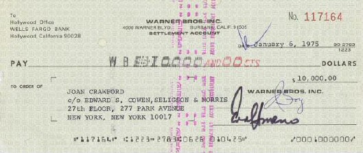 Warners tax check to Joan. (See below photo for endorsement on back.)