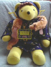 Joan Pawford as 'Mommie Bearest' from the North American Bear VIB series. Note the hanger earrings! (Not wire!)