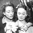 1945. Knitting with Ann Blyth on the set of 'Mildred.'