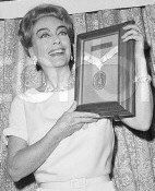 Joan picks up her '65 USO award. Source: CORBIS